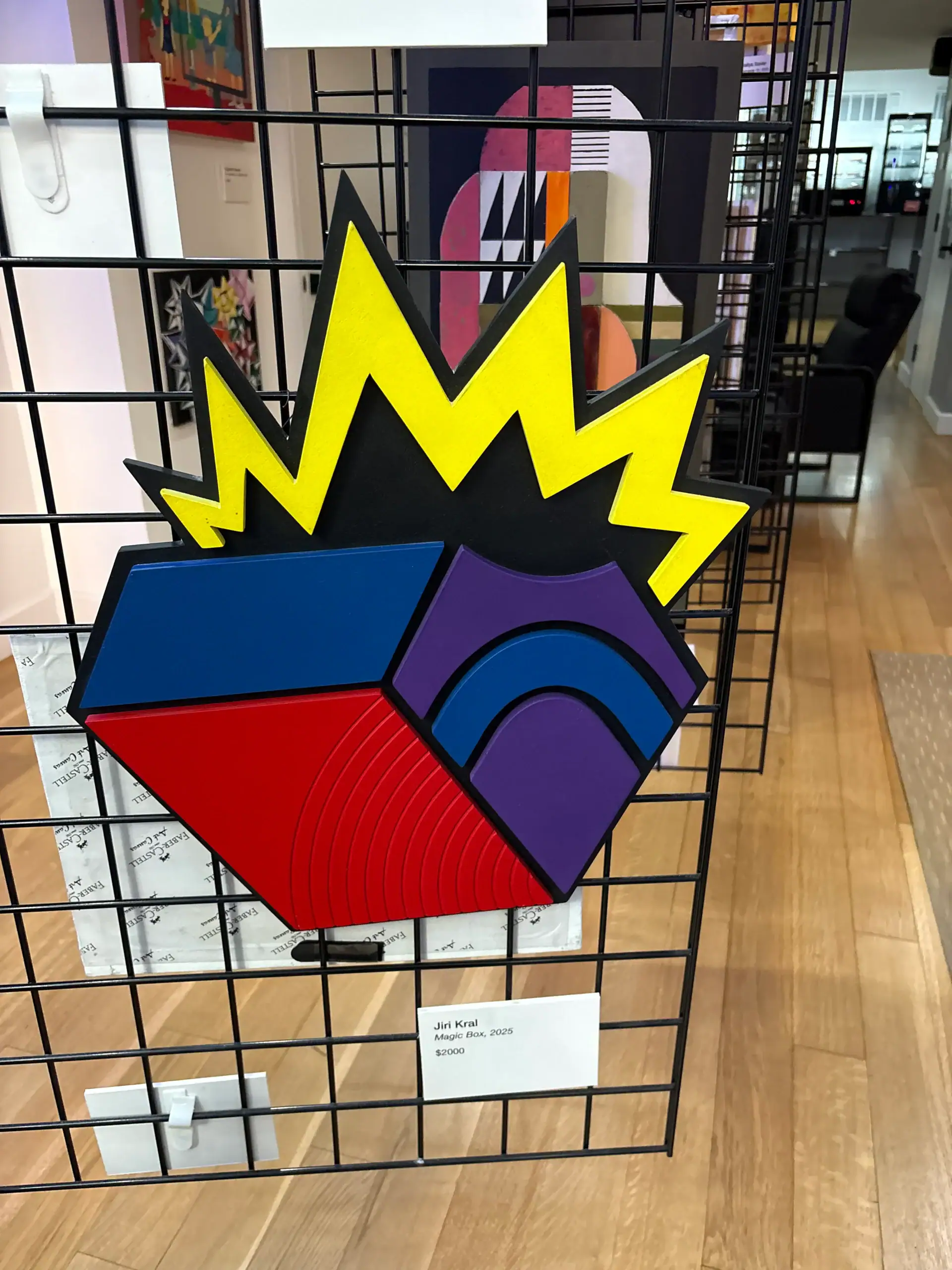 Vibrant geometric artwork with zigzag yellow, red, and blue shapes, ideal for a Wine Bar & Art Gallery.