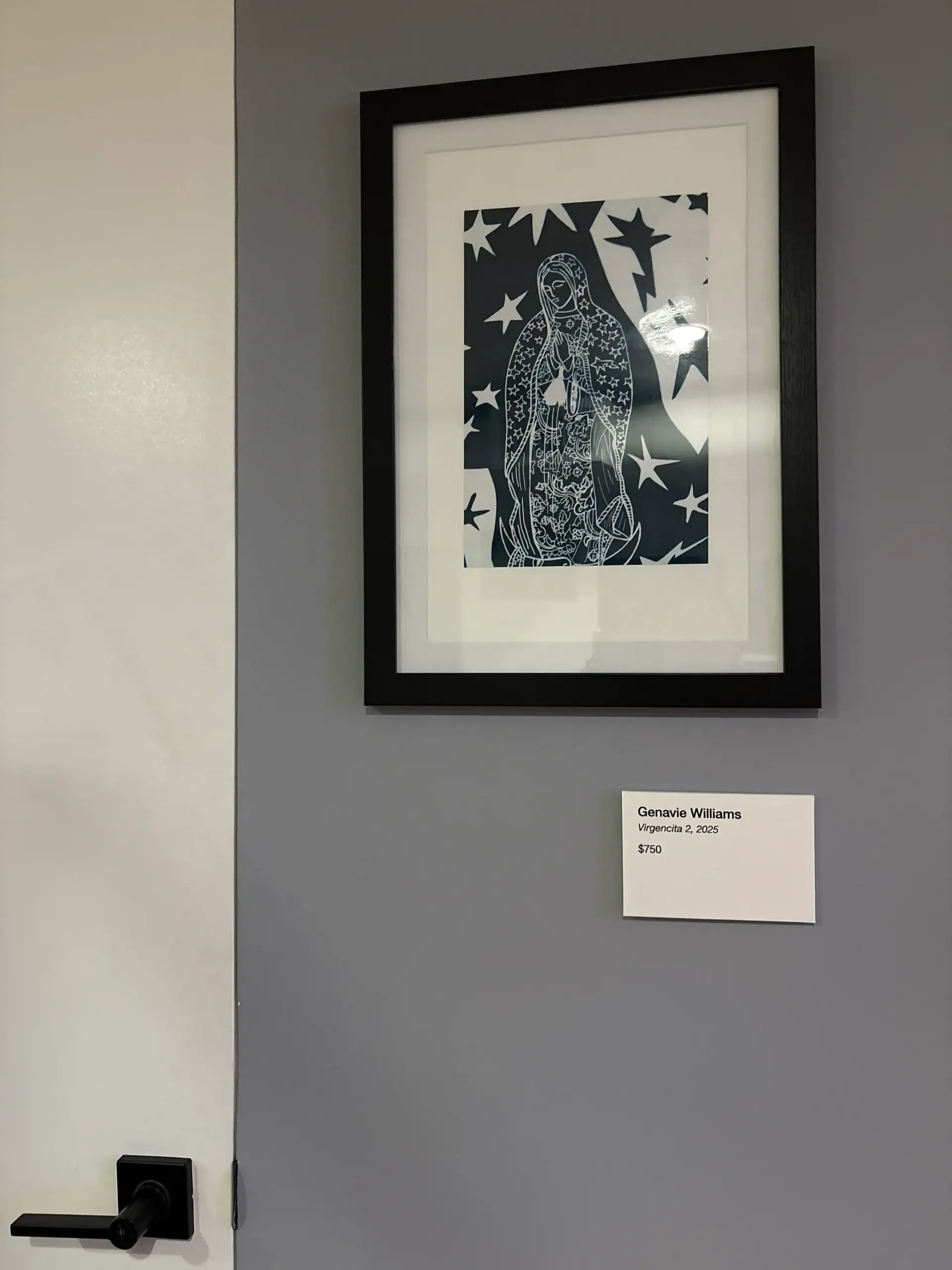Framed artwork of a starry figure at a Wine Bar & Art Gallery in NYC, displayed with an info card.