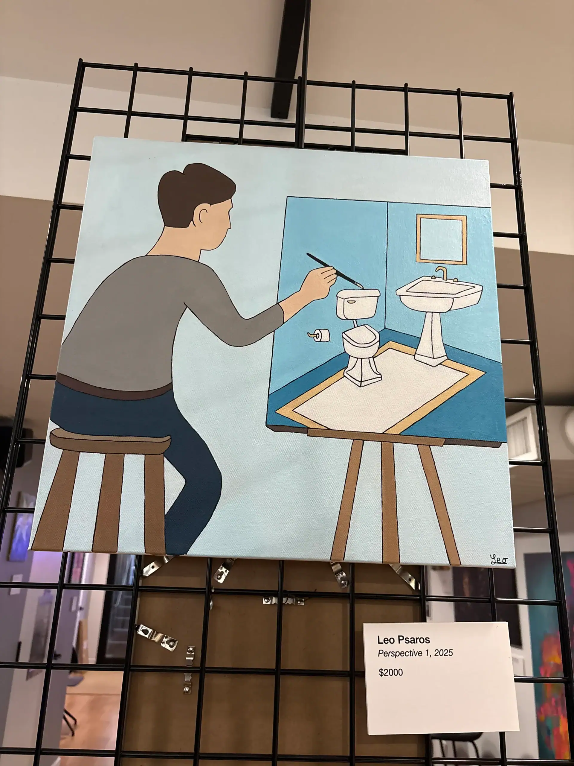 An artist paints a sink and toilet on a wall at a Wine Bar & Art Gallery in New York City.